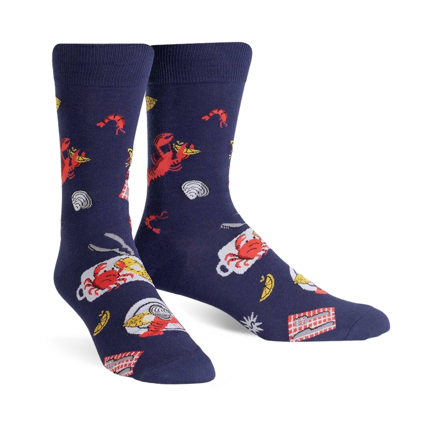 Pair of navy blue crew socks with a whimsical design featuring red lobsters, crabs, lemon slices, and other seafood boil elements.