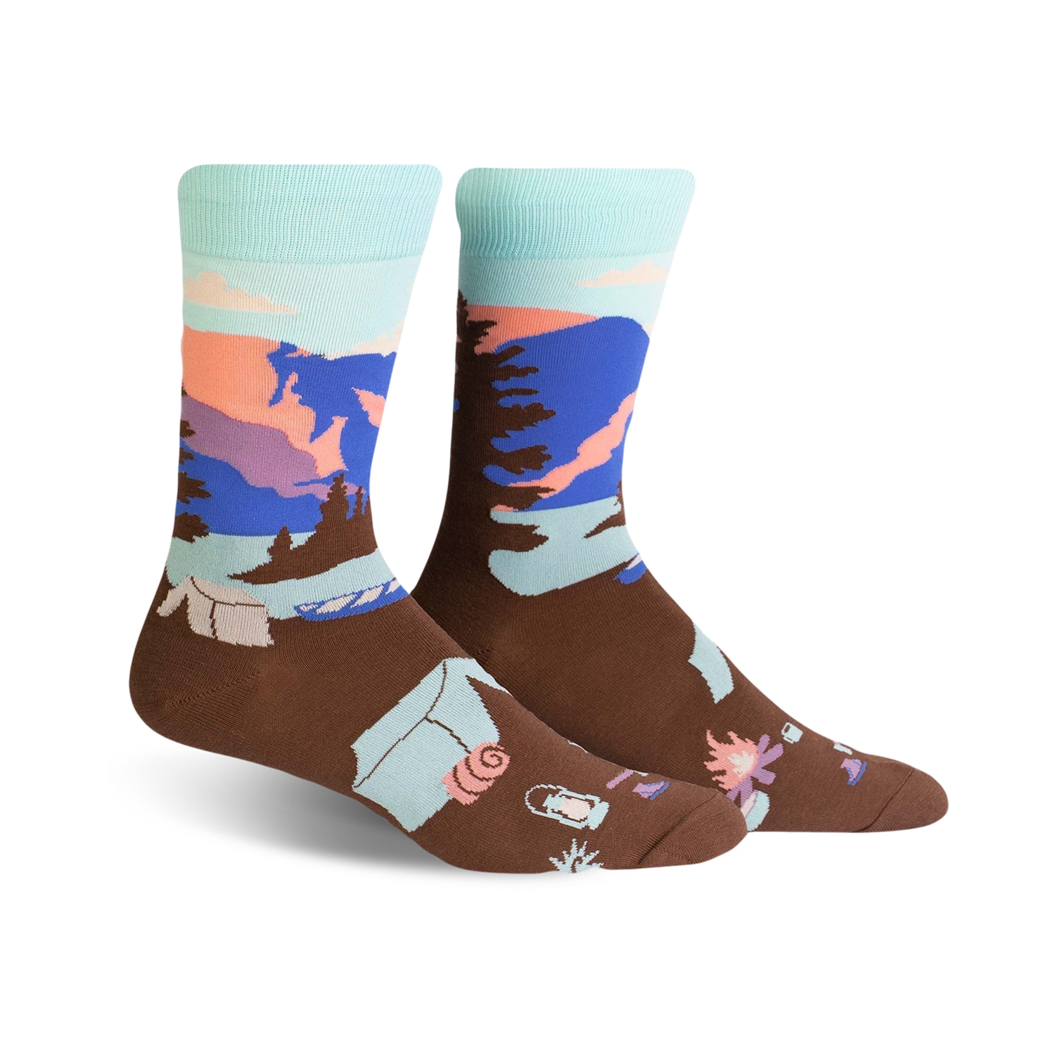 Brown crew socks with a pastel Glacier National Park scene. Features mountains, trees, and camping icons.