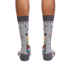Rear view of a pair of gray 'Genius at Work' socks, showing the full design on the back of each sock.