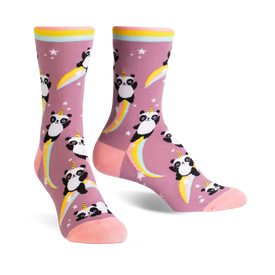 a pair of pink crew-length socks featuring a whimsical design of pandas with unicorn horns, depicted rocketing into space on trails of rainbows.