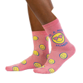Lifestyle shot showing the 'Be a Nice Human' socks on a model's legs.