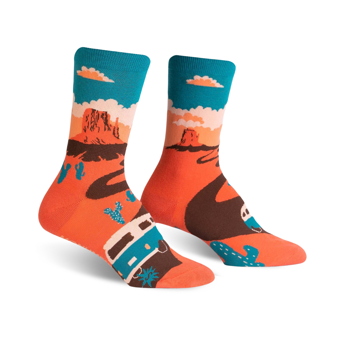 A pair of crew socks with a Monument Valley theme.  The socks are coral orange with a brown winding road, teal camper van, and cacti against a teal sky.