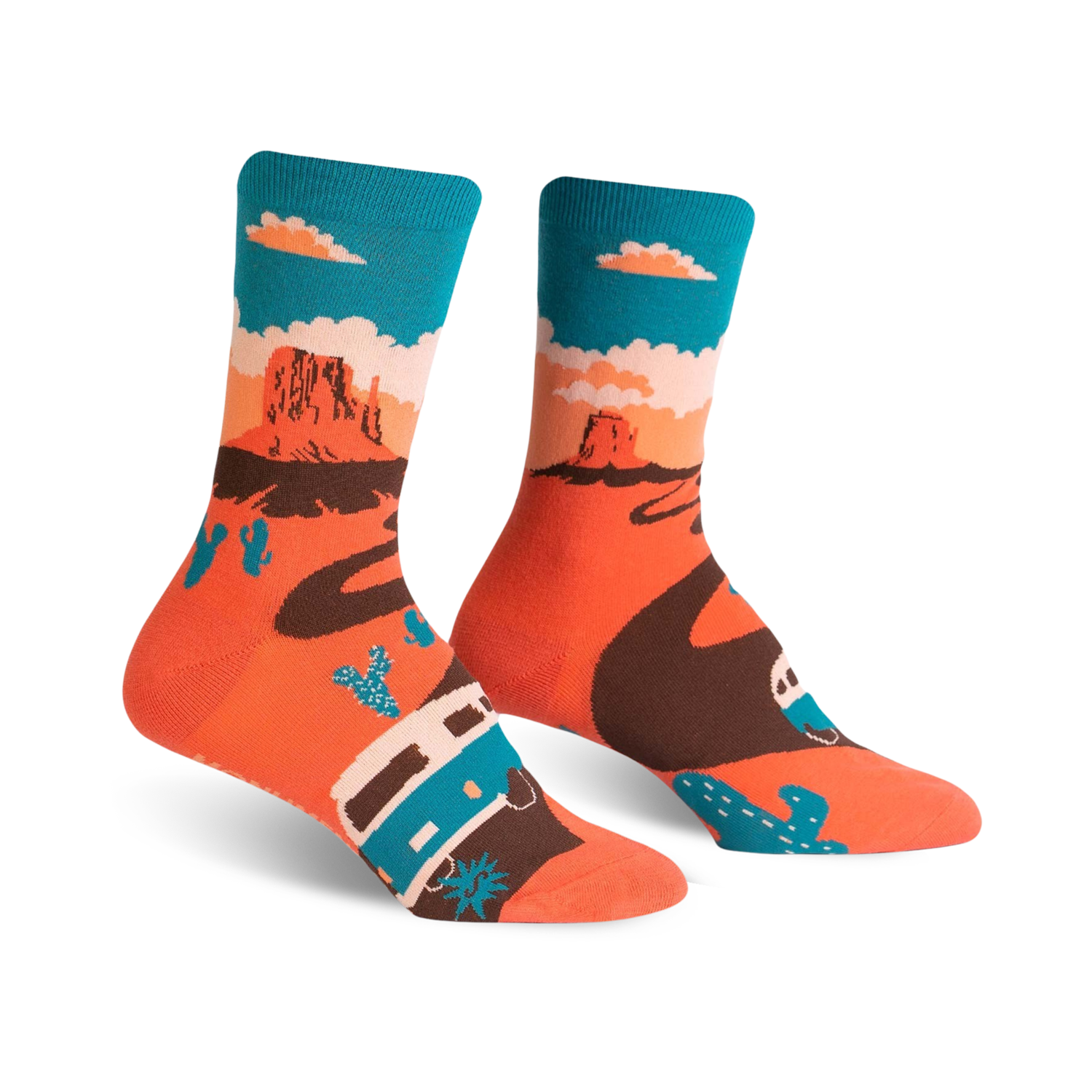 A pair of crew socks with a Monument Valley theme.  The socks are coral orange with a brown winding road, teal camper van, and cacti against a teal sky.