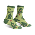 Crew socks in green and brown featuring happy cartoon trees, pine cones, and leaves.  The text 'May the Forest Be With You' is on one sock.