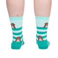 Back view of the otter socks on a model, showing the design on the back of the socks.