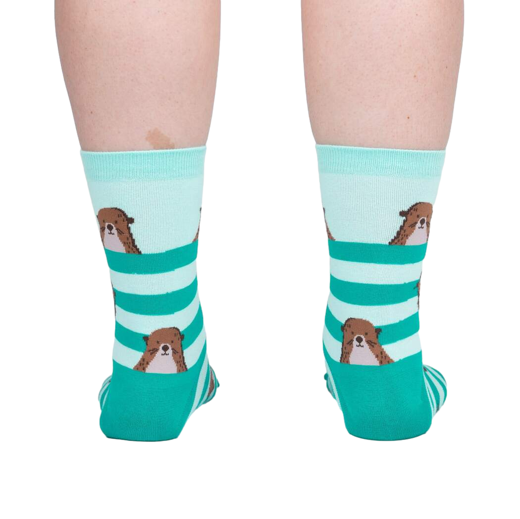 Back view of the otter socks on a model, showing the design on the back of the socks.