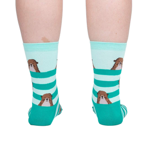Back view of the otter socks on a model, showing the design on the back of the socks.