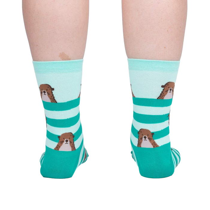 Back view of the otter socks on a model, showing the design on the back of the socks.