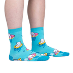 Lifestyle shot showing the socks on a person's feet; teal crew socks with white cats on donut floats.