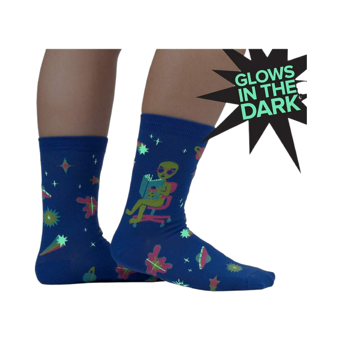 Lifestyle shot of the socks glowing in the dark, highlighting the glow-in-the-dark feature.