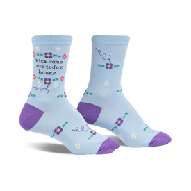 light blue floral crew socks with purple toes, heels, and text that says 'kick some ass today honey' in dark purple thread.  
