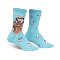 Pair of light blue crew socks featuring a cute hedgehog in a flower pot wearing a daisy crown, surrounded by smaller daisies.