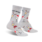 Pair of grey crew socks with a festive design. Features champagne glasses wearing Santa hats and reindeer antlers, along with candy canes and holly.