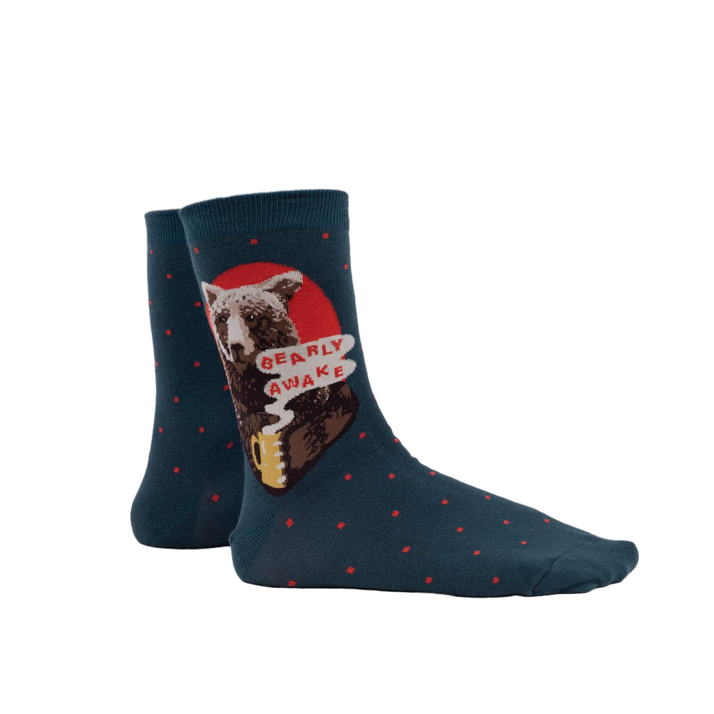 Lifestyle shot of a person wearing the 'Bearly Awake' socks, showcasing how they look when worn.