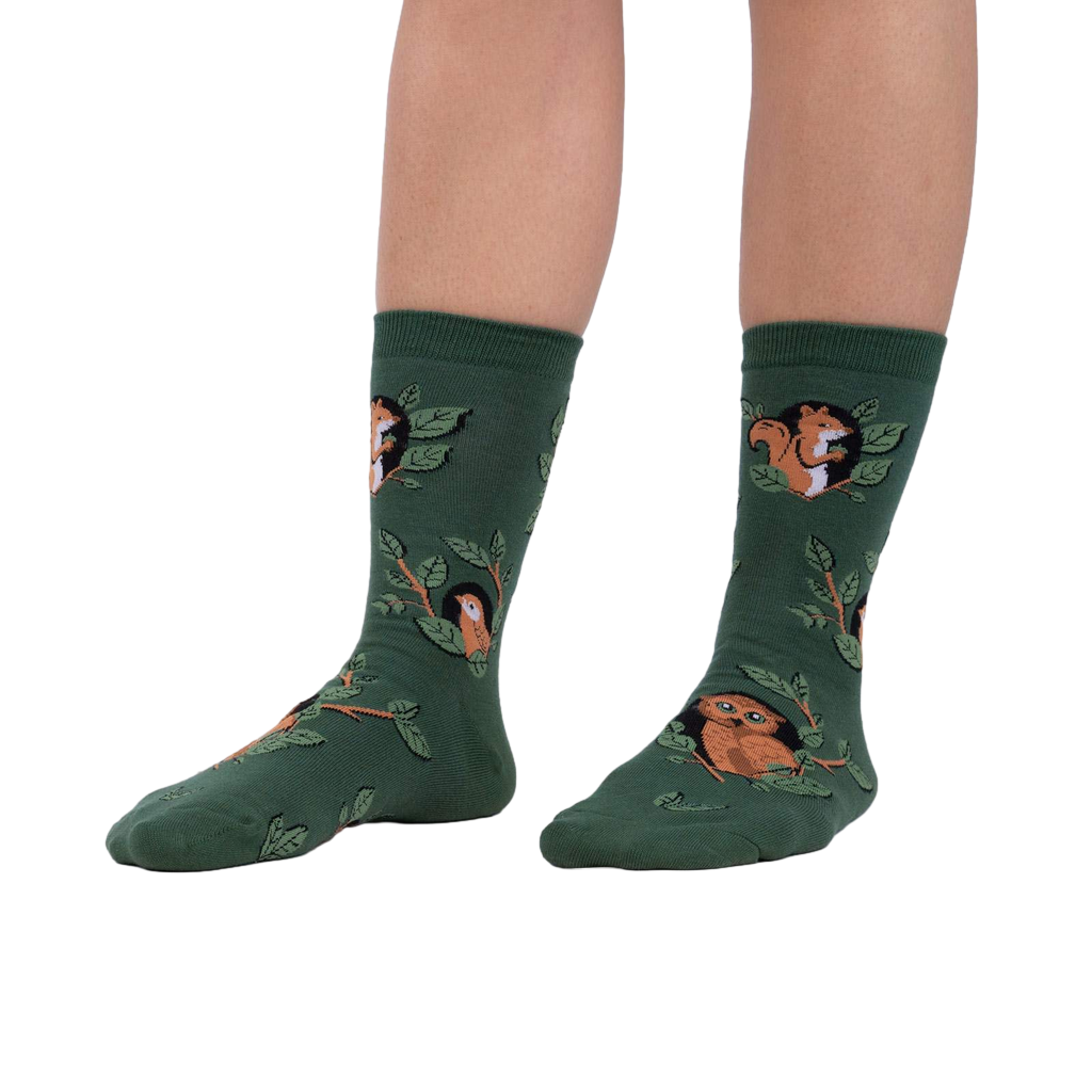 Lifestyle shot showing model wearing the Woodland Watcher socks, showcasing their fit and design.