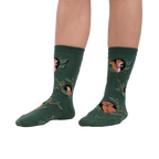 Lifestyle shot showing model wearing the Woodland Watcher socks, showcasing their fit and design.