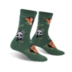 Pair of crew socks in deep green with repeating pattern of squirrels, raccoons, and owls perched on leafy branches.
