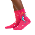 Lifestyle shot showing the socks on a person's legs. They're pink with a unicorn and narwhal graphic.