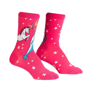 Pair of pink crew socks with a white unicorn and narwhal design battling each other. White stars are scattered across the background.