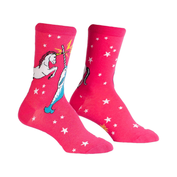 Pair of pink crew socks with a white unicorn and narwhal design battling each other. White stars are scattered across the background.