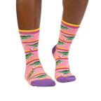 Lifestyle shot of Rawr-ler Rink socks on a person's legs, showcasing the socks' fit and pattern.