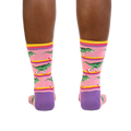 Rear view of a person wearing the Rawr-ler Rink socks, highlighting the full design.