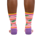 Rear view of a person wearing the Rawr-ler Rink socks, highlighting the full design.