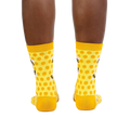 Rear view of the yellow honeycomb bee socks on a model.