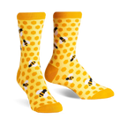 Pair of crew socks in yellow and black. The socks have a honeycomb pattern with little bees.