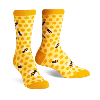 yellow crew socks featuring a black hexagon and bee pattern. perfect for women who love bees.   
