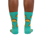 Rear view of Tacosaurus socks on a model's legs, highlighting the full design.