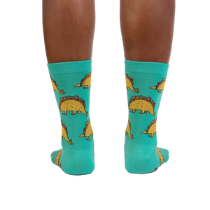 Rear view of Tacosaurus socks on a model's legs, highlighting the full design.