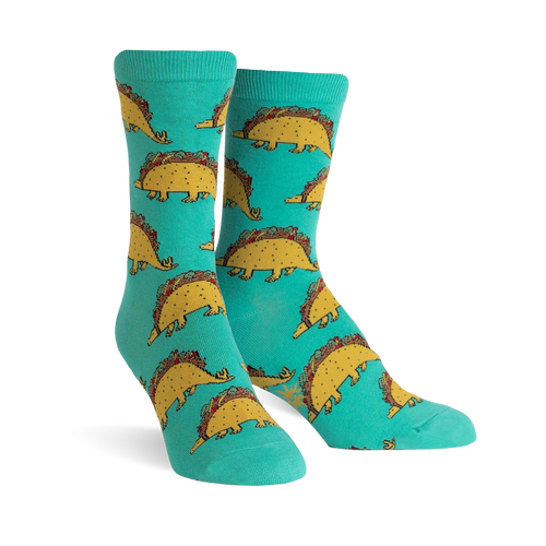 Teal crew socks with a repeating pattern of cute dinosaurs made of tacos. 
