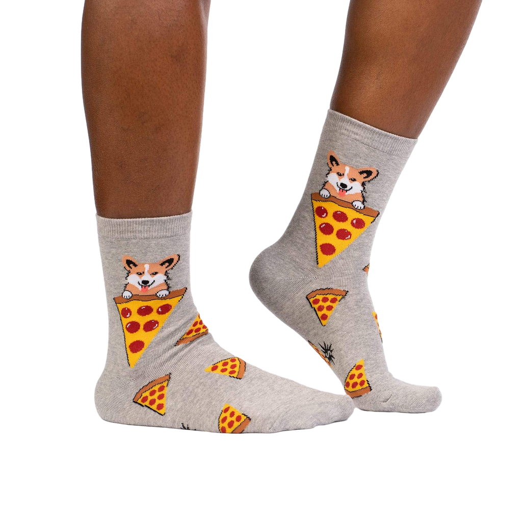 Lifestyle shot of a person wearing the corgi and pizza socks, showing how they look on the feet.