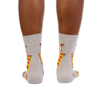 Rear view of a person wearing the 'Best Friends' socks, showcasing the design on the back of the socks.