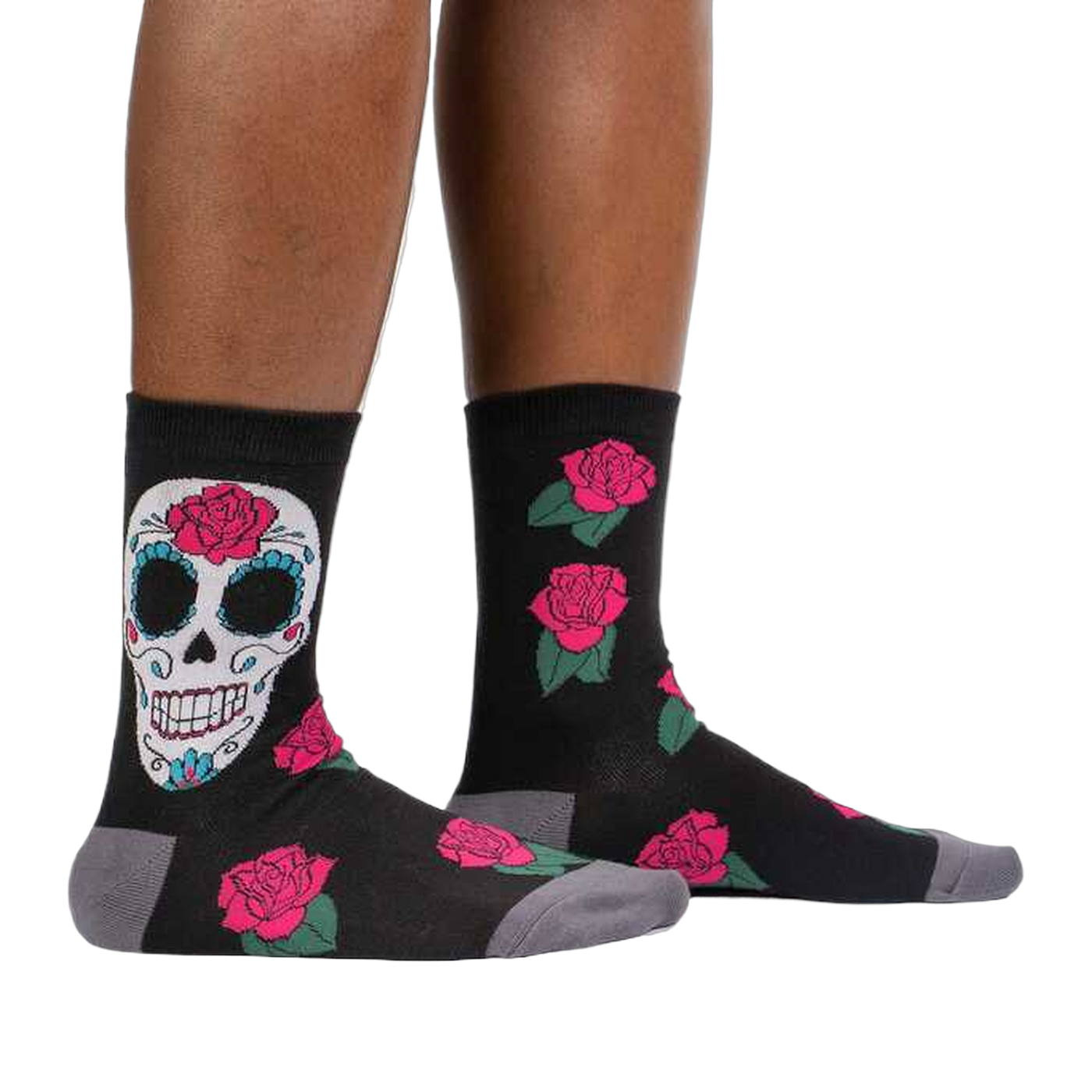 Lifestyle shot: A person's legs wearing the Sugar Skull socks, showcasing how they look when worn.