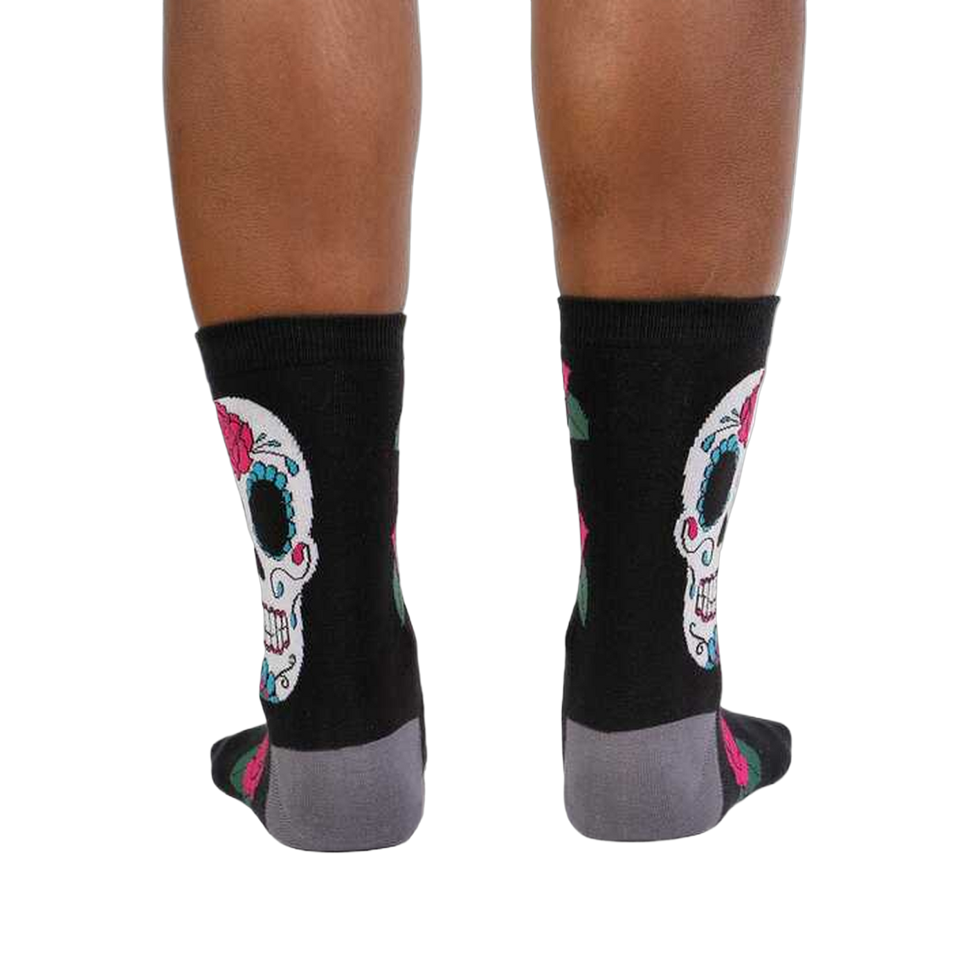 Rear view of the Sugar Skull socks on a person's legs. Shows the back design.