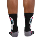 Rear view of the Sugar Skull socks on a person's legs. Shows the back design.