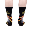 Rear view of a person wearing the 'Secret Powers' socks.  The cat and stripes are partially visible.