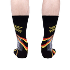Rear view of a person wearing the 'Secret Powers' socks.  The cat and stripes are partially visible.