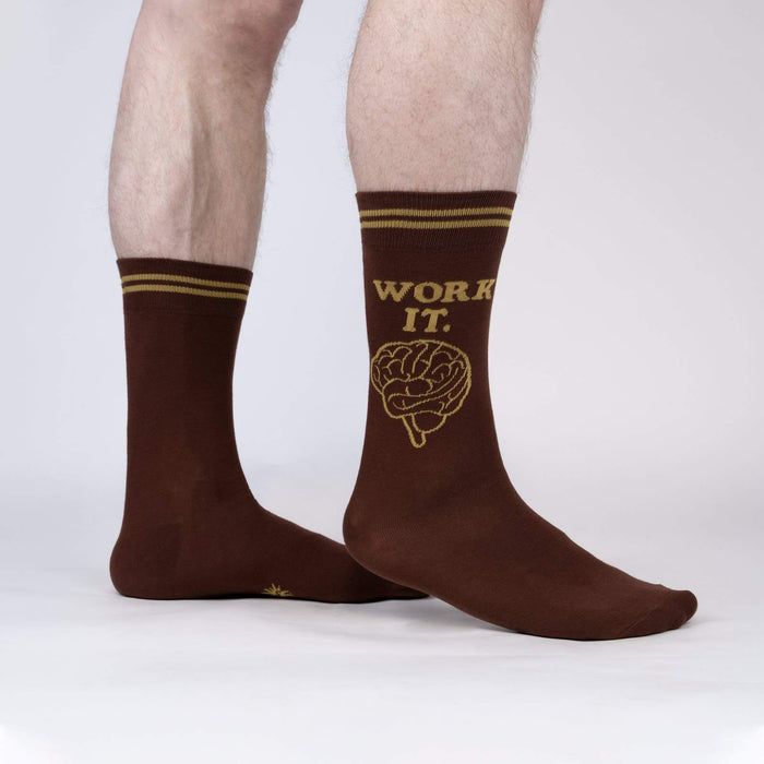 A pair of brown crew socks with the words 