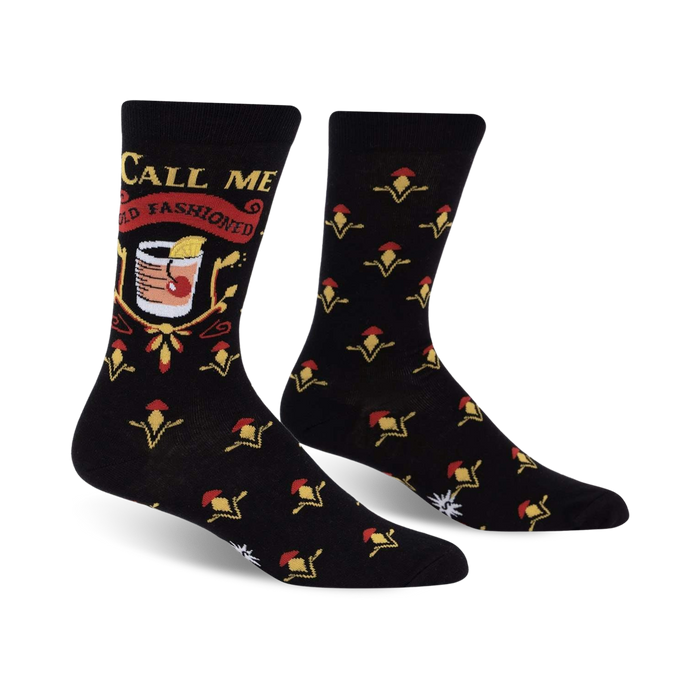 black crew socks with yellow flower pattern. text on left sock says 
