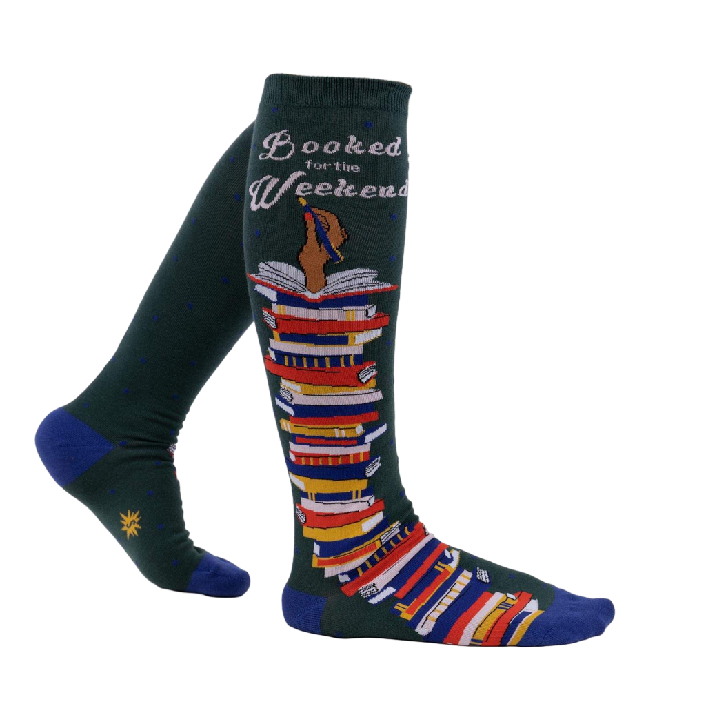 Lifestyle shot of a person wearing the 'Booked for the Weekend' knee-high socks, showing how they look when worn.