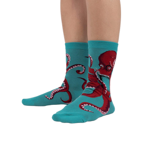 Lifestyle shot showing The Octive Reader socks on a person's feet, showcasing the fit and teal color.