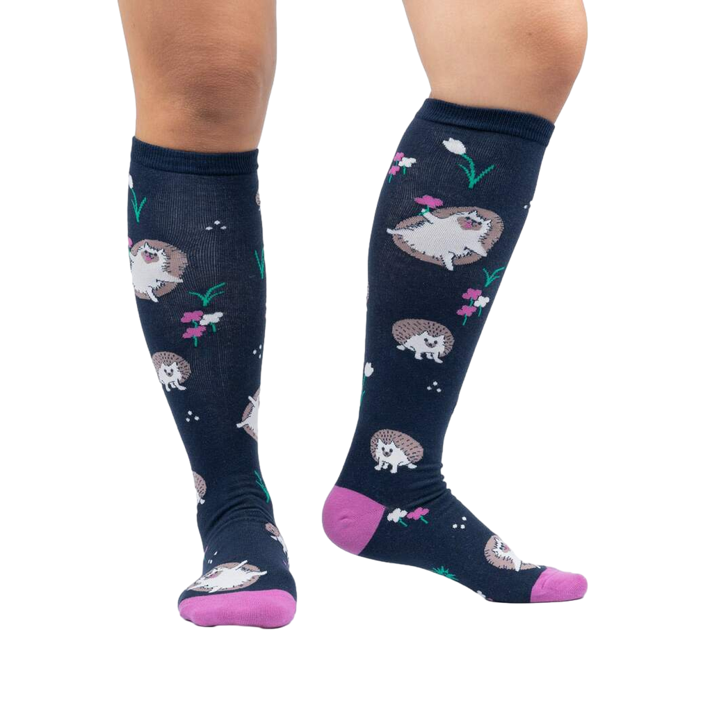 Lifestyle photo showing the 'Rollin' with my Hedgehog' knee-high socks on a person's legs against a white background.