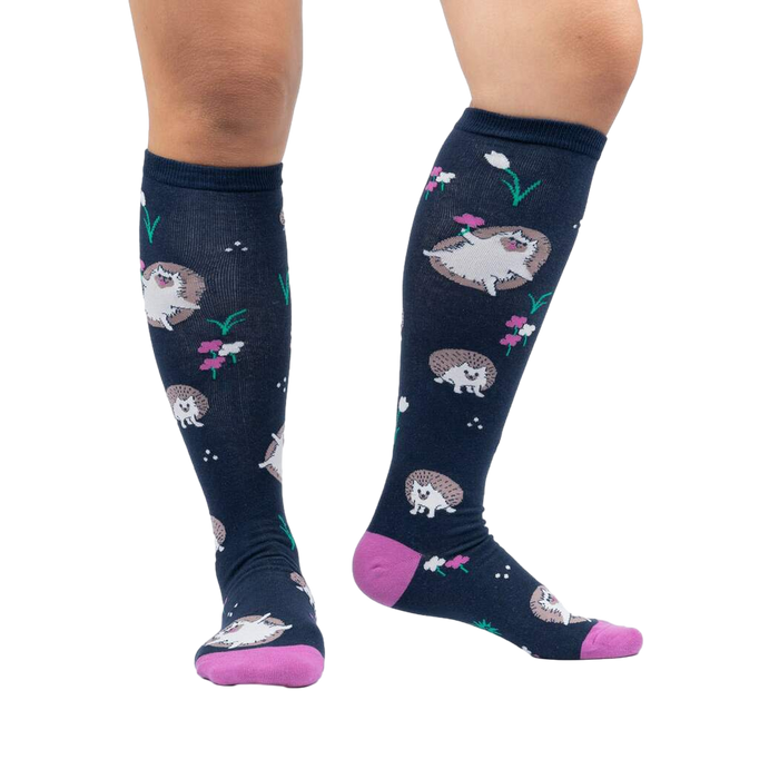 Lifestyle photo showing the 'Rollin' with my Hedgehog' knee-high socks on a person's legs against a white background.