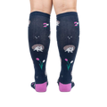 Rear view of a person wearing the 'Rollin' with my Hedgehog' knee-high socks, showcasing the back design and color.