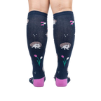 Rear view of a person wearing the 'Rollin' with my Hedgehog' knee-high socks, showcasing the back design and color.