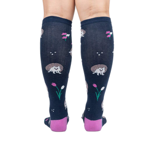 Rear view of a person wearing the 'Rollin' with my Hedgehog' knee-high socks, showcasing the back design and color.