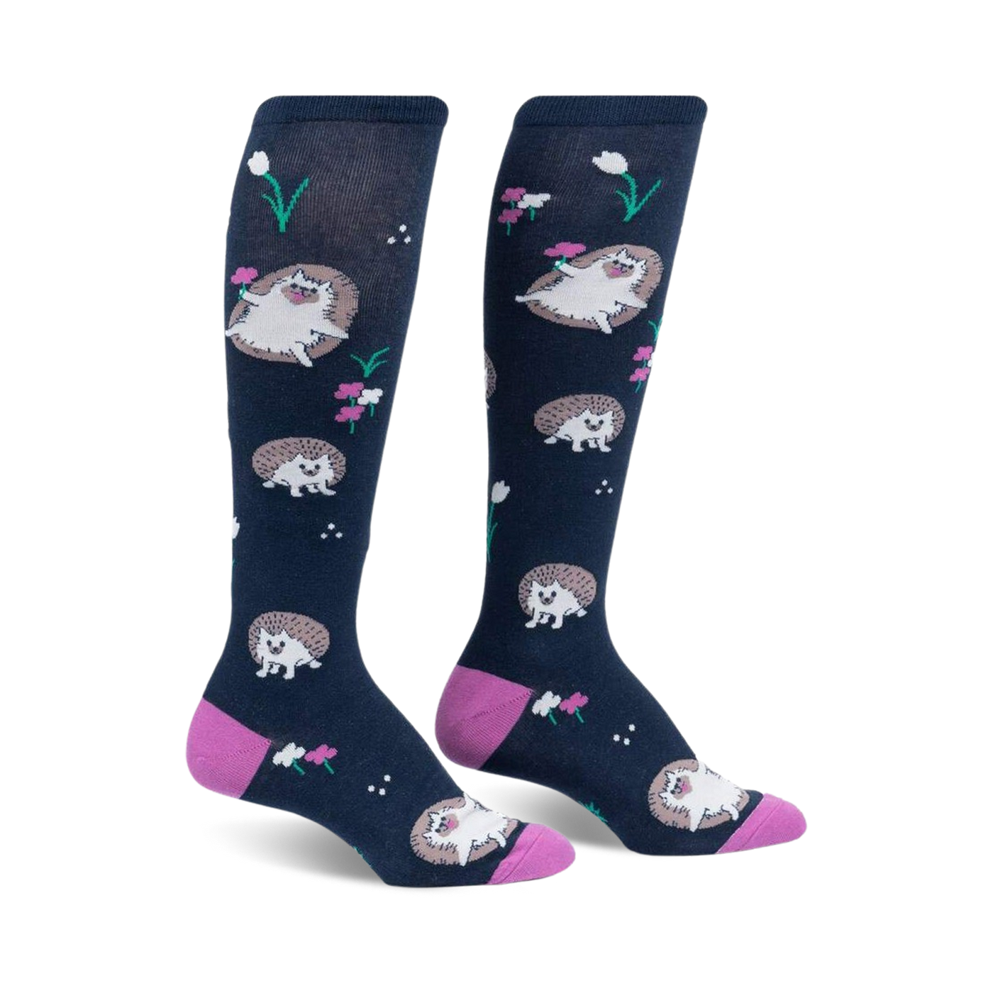 Pair of navy blue knee-high socks with a repeating pattern of cute hedgehogs and pink flowers.  Pink heel and toe.